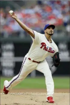  ??  ?? MATT SLOCUM — THE ASSOCIATED PRESS Pitcher Zach Eflin played the role of stopper as he tossed six solid innings to help the Phillies snap a four-game losing streak with a 4-3 victory over the Milwaukee Brewers Sunday at Citizens Bank Park.