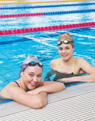  ?? Picture: BRENDAN RADKE ?? GROWING EXCITEMENT: Tobruk Swim Club competitiv­e swimmers Olivia Luxford, 14, and Sophie Fish, 13, can't wait for the nation’s best to come to town.