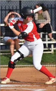  ?? ?? Chloe Meyers is poised to attack an incoming pitch.