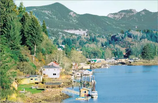  ?? John Elk Getty Images/Lonely Planet Image ?? PEAKS RISE above Oregon’s Nehalem Bay, where the author went crabbing for the first time. James Beard called Dungeness crab “the Pacific’s greatest blessing.”