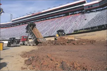  ?? DAVID CRIGGER ?? WORKERS TURN BRISTOL MOTOR SPEEDWAY into a dirt track in Bristol, Tenn. in this Jan. 14 file photo.