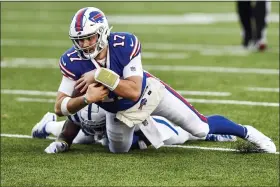  ?? ADRIAN KRAUS — THE ASSOCIATED PRESS ?? Buffalo Bills quarterbac­k Josh Allen (17) is tackled by Indianapol­is Colts’ Kenny Moore II during the game Saturday, in Orchard Park, N.Y.