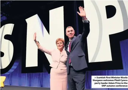  ??  ?? &gt; Scottish First Minister Nicola Sturgeon welcomes Plaid Cymru party leader Adam Price to the SNP autumn conference