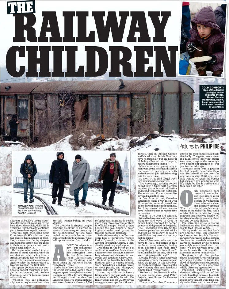  ?? Pictures by PHILIP IDE ?? FROZEN OUT: Young migrants trudge through the snow at the railway depot in Belgrade COLD COMFORT: One of the derelict carriages where migrants shelter. Above: Carmen Mohammad, seven, tucks into a meal of lentil stew provided by volunteers