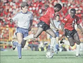  ?? Mark Lennihan Associated Press ?? PAUL CALIGIURI of the U.S., left, battles for the ball during a 1989 match against Trinidad and Tobago. Caligiuri would score the only goal of the game.