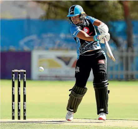  ?? GETTY IMAGES ?? Sophie Devine plays a cut shot during her match-winning innings in Alice Springs yesterday.