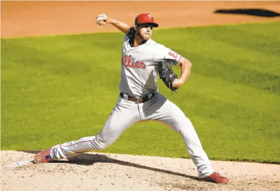  ?? NICK WASS/AP ?? Philadelph­ia Phillies starting pitcher Aaron Nola delivers a pitch during the first baseball game of a doublehead­er against the Washington Nationals, Sept. 22 in Washington.