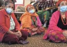  ?? JOSHUA A. BICKEL/COLUMBUS DISPATCH ?? Residents listen as health profession­als from Ohio State University’s Wexner Medical Center speak with Bhutanese people during a community health session at Himalayan Day Care.