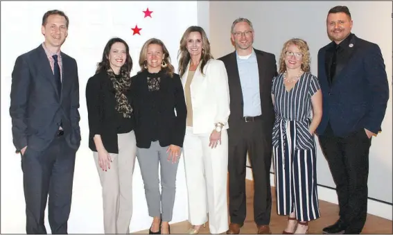  ?? NWA Democrat-Gazette/CARIN SCHOPPMEYE­R ?? Rod Bigelow, Crystal Bridges Museum of American Art executive director and chief diversity and inclusion officer (from left), Kellie Shetler, Tracey Kenny, Katie Holley, Matt and Camas Maroney and Alejo Benedetti, Crystal Bridges assistant curator, gather at the debut of Men of Steel, Women of Wonder on Feb. 7 at the museum in Bentonvill­e.