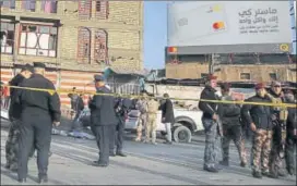  ?? AFP ?? Iraqi security forces cordon off the area where the double suicide bombing took place.