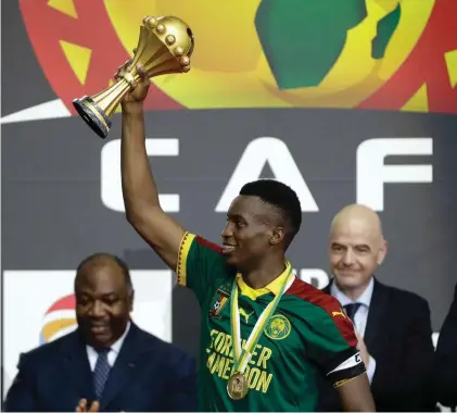  ??  ?? Cameroon’s Benjamin Moukandjo lifting the trophy after winning the African Cup of Nations final against Egypt. African football’s biggest tournament could be moved from the start of the year to the European summer months of June and July, with the...