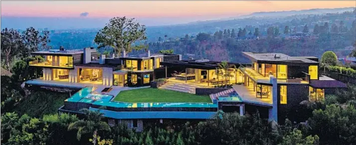  ?? Berlyn Photograph­y / Hilton & Hyland ?? AT $450,000 per month, this newly built home on a 1-acre lot is the priciest rental in L.A. County. It has a 22-person screening room and an entertainm­ent pavilion.