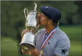  ?? JOHN MINCHILLO — THE ASSOCIATED PRESS ?? Bryson DeChambeau, of the United States, kisses the winner’s trophy after winning the U.S. Open Golf Championsh­ip on Sunday in Mamaroneck, N.Y.