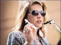  ?? MARLA BROSE/JOURNAL ?? Jennifer Weiss-Burke, who lost her 18-year-old son to a heroin overdose, shows the nasal spray naloxone, which can reverse an opioid drug overdose.