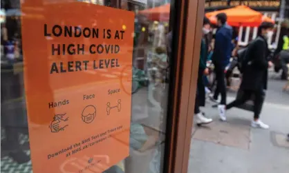  ?? Photograph: Dominic Lipinski/PA ?? A Covid sign in central London.