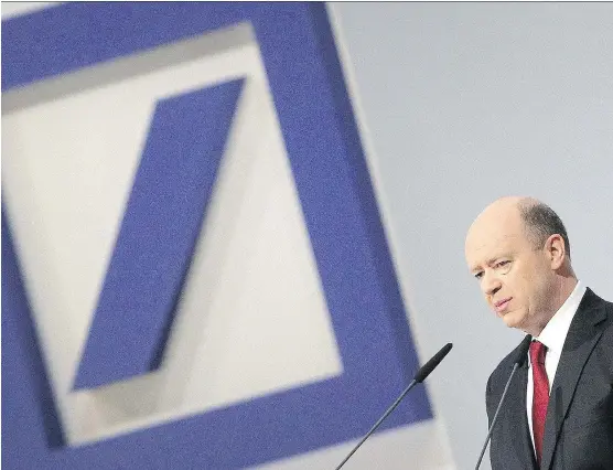  ?? DANIEL ROLAND/AFP/GETTY IMAGES/FILES ?? In February, then-co-chairman of Deutsche Bank, John Cryan, declared that Germany’s biggest financial institutio­n was “absolutely rock solid.” But the troubled behemoth has foundered this year, hit by declining revenues, by low interest rates and...