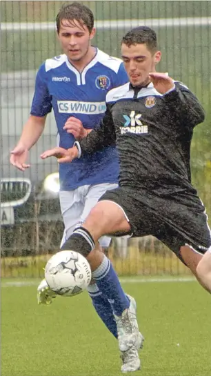  ?? Football photograph­s: Iain Ferguson, The Write Image ?? Fort William’s Barna Tot takes control of the action chased by Campbeltow­n’s Ryan Deans.