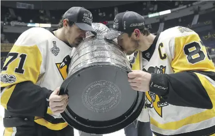  ?? BRUCE BENNETT/GETTY IMAGES FILES ?? With back-to-back Stanley Cups to the team’s name, Evgeni Malkin and Sidney Crosby will now try to make the Pittsburgh Penguins the first club to win three straight since the 1980s.