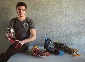  ?? REUTERS PIC ?? David Aguilar posing with his prosthetic arms built with Lego pieces during an interview in Sant Cugat del Valles near Barcelona recently.