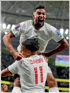  ?? GETTY IMAGES/AP ?? Belgium goalkeeper Thibaut Courtois had a tough day at the office at the World Cup against Morocco. Inset: Yahya Jabrane, top, celebrates with Abdelhamid Sabiri after one of Morocco’s two goals.