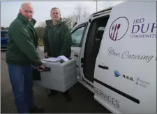  ??  ?? Tom Healy and Seán O’Connell loading up ahead of the daily Meals on Wheels delivery at IRD Duhallow.