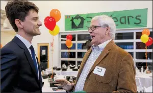  ?? Arkansas Democrat-Gazette/BENJAMIN KRAIN ?? Our House Executive Director Ben Goodwin (left) and Our House founding board President Henry Tuck discuss the growth of the organizati­on over its 30 years during a lunch Tuesday at the organizati­on’s anniversar­y celebratio­n.