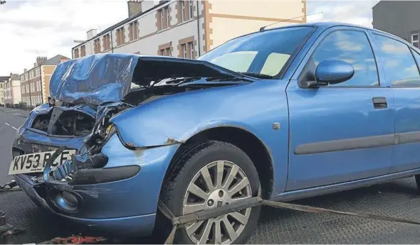  ??  ?? One of the cars involved pictured after being loaded on to a recovery truck at the scene.