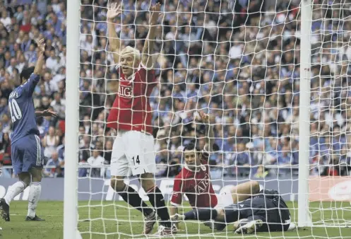  ??  ?? 0 Ryan Giggs, grounded, believes he has scored against Chelsea in the 2007 FA Cup final, but the ball was ruled not to have crossed the line.