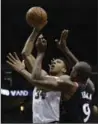  ?? MORRY GASH, THE ASSOCIATED PRESS ?? Bucks’ Giannis Antetokoun­mpo shoots over Raptors’ Serge Ibaka. Toronto won, 129-110.