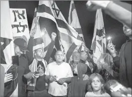  ?? TSAFRIR ABAYOV/AP ?? Israeli protesters in the southern city of Ashkelon demonstrat­e Wednesday against the cease-fire brokered between Prime Minister Benjamin Netanyahu and Hamas.