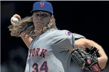  ?? PATRICK SMITH/GETTY IMAGES ?? Mets ace Noah Syndergaar­d has been placed on the disabled list with a torn lat muscle. There is no timetable for his return.