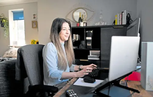  ?? —PHOTOS BY AFP ?? SANS THE VIBE Rachel Watson works in her living room in Nunhead, London, on March 30. Watson says she enjoys working from home but misses interactin­g with people at the office.