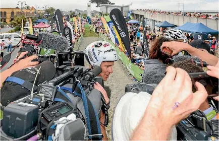  ?? PHOTO: GETTY IMAGES ?? Sam Clark speaks to the media after winning the one-day individual competitio­n of the Coast to Coast race.