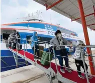  ?? Photo: CNA ?? Passengers arrive in Quemoy from the mainland. Many on the island are hoping for a full reopening to mainland tourists.