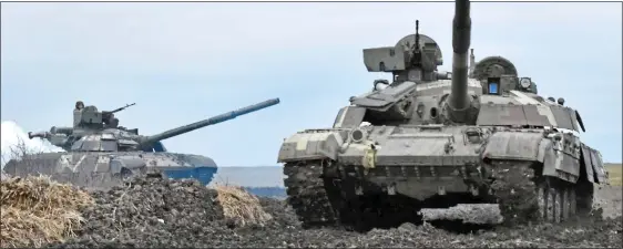  ??  ?? FLASHPOINT: Ukrainian tanks near the border of Crimea, annexed in 2014 by Russia after a Western-backed putsch deposed Ukraine’s non-aligned president