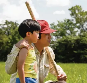  ?? Sundance Institute/TNS ?? Alan Kim, left, and Steven Yeun star in “Minari,” about a Korean American family starting a farm in 1980s Arkansas.