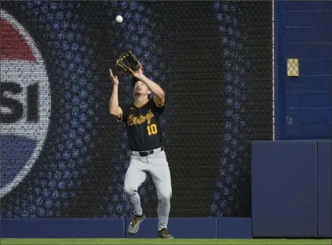  ?? Wilfredo Lee/Associated Press ?? Right fielder Bryan Reynolds catches the final out of the game Thursday, preserving a 6-5 win for the Pirates in Miami.