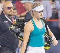  ?? CP PHOTO ?? Eugenie Bouchard of Canada walks off the court after losing to Kristina Kucova of Slovakia during third round of play at the Rogers Cup tennis tournament Thursday in Montreal.