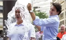  ?? DAN RIEDLHUBER/REUTERS FILE PHOTO ?? Justin Trudeau treated Liberal MP Sean Casey to the Ice Bucket Challenge.