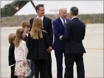  ?? EVAN VUCCI — THE ASSCIATED PRESS ?? President Joe Biden greets Eric Garcetti, Mayor of Los Angeles, right, as California Gov. Gavin Newsom, Dutch William Siebel Newsom, 6, Hunter Siebel Newsom, 10, Montana Tessa Siebel Newsom, 11, Brooklynn Siebel Newsom, 8, look on after arriving at LAX on June 8, 2022, in Los Angeles.