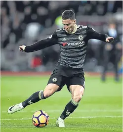  ?? Picture: Getty Images. ?? Eden Hazard scores Chelsea’s first goal in last night’s Premier League match against London rivals West Ham.