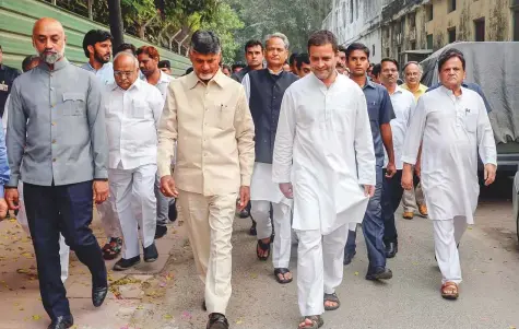  ?? PTI ?? Congress President Rahul Gandhi and Andhra Pradesh Chief Minister Chandrabab­u Naidu, along with other leaders, go to address the media after a meeting at the former’s residence in New Delhi, yesterday.