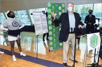  ?? Arnold Gold / Hearst Connecticu­t Media ?? Jim Calhoun, former men’s basketball coach for the University of Connecticu­t and now coach at the University of St. Joseph in West Hartford, speaks at a vaccine clinic for people 16+ at Hill Regional Career High School in New Haven Thursday.