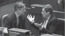  ?? STEVE RUSSELL/TORONTO STAR FILE PHOTO ?? John Tory, speaking with councillor Gord Perks, is marking a year as mayor.