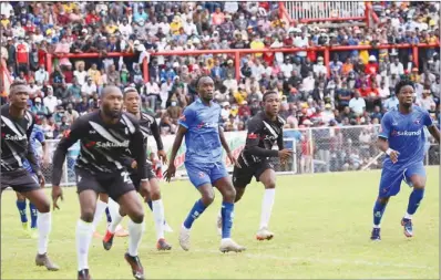  ?? ?? Highlander­s forward Stanley Ngala (second from right) prepares to take on a through pass at Barbourfie­lds Stadium on Monday