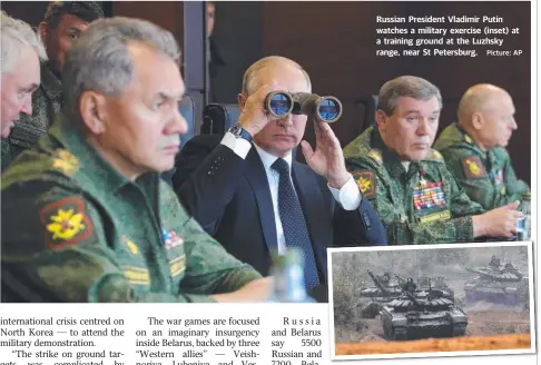  ?? Picture: AP ?? Russian President Vladimir Putin watches a military exercise (inset) at a training ground at the Luzhsky range, near St Petersburg.