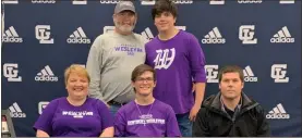  ?? Contribute­d ?? Gordon Lee’s Tomy Duke was joined by parents Aimee and Thomas Duke, along with his brother, Timy, and Trojan head wrestling coach Jason Mull, to celebrate his signing with NCAA Division II Kentucky Wesleyan College this past Friday.