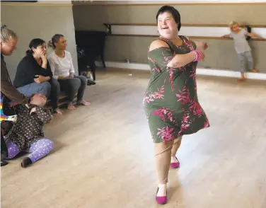  ?? Photos by Guy Wathen / The Chronicle ?? Olivia Byers-Straus, who has Down syndrome, teaches at Steppin’ Out Dance Studio in the Mission District.