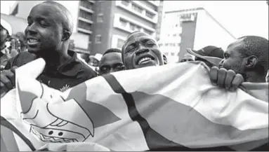  ??  ?? Supporters of the opposition MDC in Harare on Tuesday. (Photo: Getty Images)