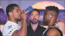  ?? REUTERS ?? Anthony Joshua (left) and Francis Ngannou face off on Wednesday ahead of Friday’s fight.